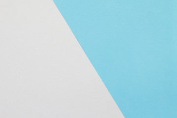 Two color paper with blue and white Overlap on the floor And split half of the image. background