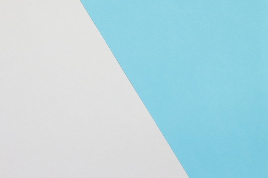 Two color paper with blue and white Overlap on the floor And split half of the image. background