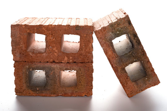 three bricks on a white background