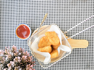fried nuggets in in a frying pan on the table