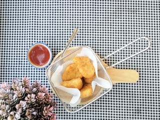 fried nuggets in in a frying pan on the table