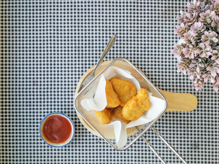 fried nuggets in in a frying pan on the table