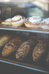 Fresh Baked Cinnamon Rolls and Bread in an Artisan Bakery Window in Reykjavik Iceland