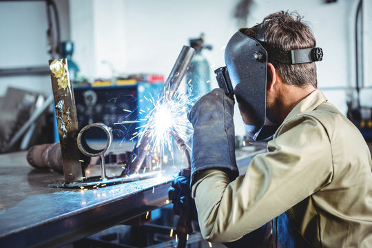 Welder welding a metal