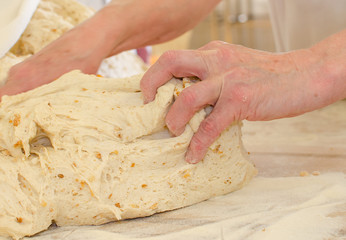 Preparing dough in a bakery.