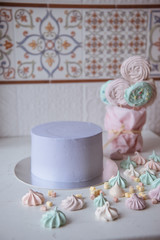 Naked wedding birthday cake. Rustic layer homemade cake with cream. Dessert decorated with chocolate and fruits. Selective focus. 