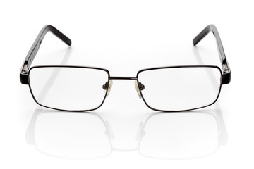Eyeglasses for vision correction in thin, black, metallic frame isolated on white background.