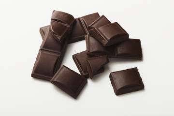 Bar of dark chocolate isolated on white