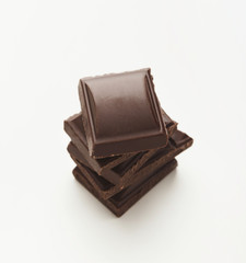 Bar of dark chocolate isolated on white