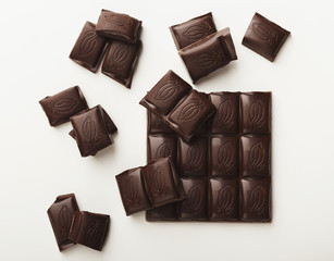 Bar of dark chocolate isolated on white
