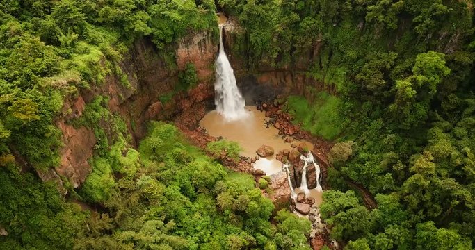 Top view of beautiful landscape of Cimarinjung waterfall from a drone at Ciletuh Geopark, Sukabumi, West Java, Indonesia. Shot in 4k resolution