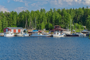 Fototapeta na wymiar A small shipyard on the shore of the lake