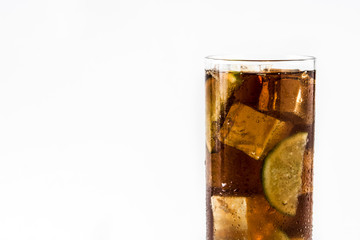 Cuba libre. Cocktail with rum, lime and ice isolated on white background. Copyspace