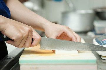 Chef cut vegetable on cutting board with knife japan,slicing radish