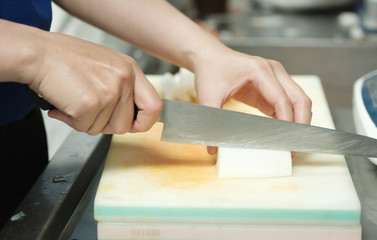 Chef cut vegetable on cutting board with knife japan,slicing radish