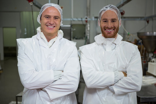 Butchers standing with arms crossed