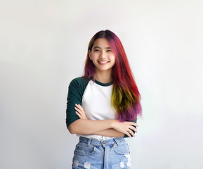 pretty asian female smiling joyfully with colorful hair in dressed casually like hipster lifestyle