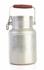 Old aluminum milk jug isolated