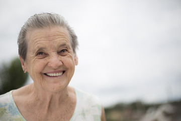 Fototapeta na wymiar Portrait of a smiling elderly woman