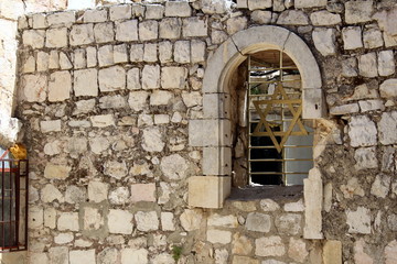Fototapeta na wymiar Wall and Star of David in the Old City of Jerusalem