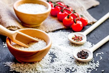 ingredients for paella on dark background