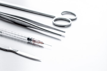 instruments for plastic surgery on white background