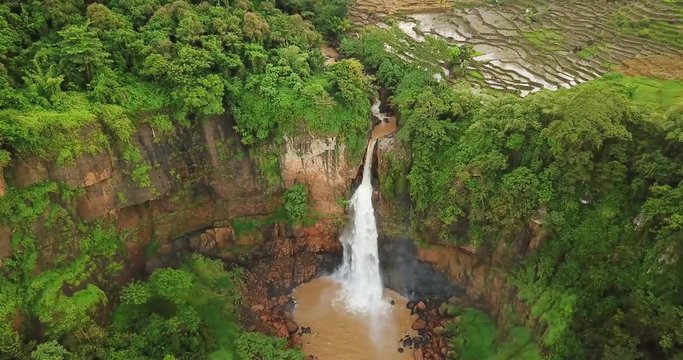 Exotic aerial landscape of Cimarinjung waterfall at Ciletuh Geopark, Sukabumi, West Java, Indonesia. Shot in 4k resolution