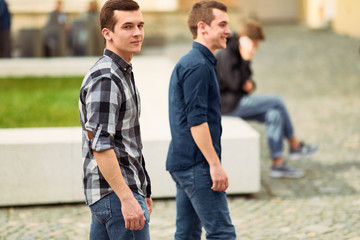 Obraz premium Two man walking on the street and look forward