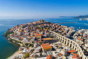 Aerial view the city of Kavala in northern Greek, ancient aqueduct Kamares, homes and medieval city...