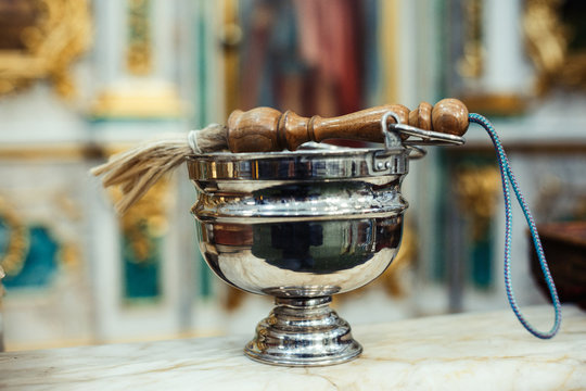 Aspergilium in aspersorium - liturgical implement used to sprinkle holy water