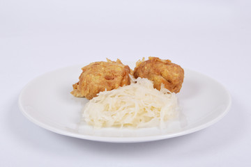 Millets potatoes dumplings with tempeh on a white