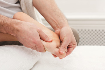 Feet massage closeup, acupressure