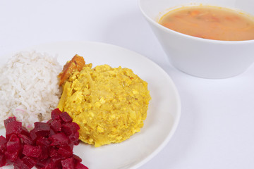 Cauliflower with turmeric and rice on a white