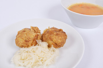 Millets potatoes dumplings with tempeh on a white