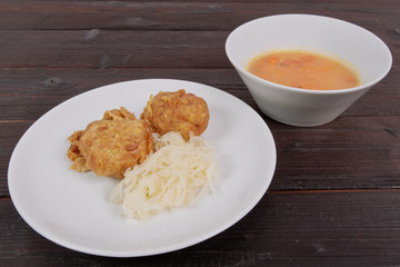 Millets potatoes dumplings with tempeh on a table