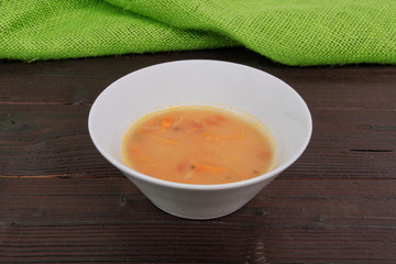 Bean soup with millets and vegetables on a table