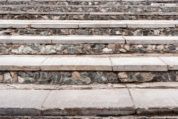 Close-up old gray stony stairway as background.