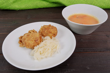 Millets potatoes dumplings with tempeh on a table