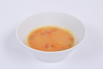 Bean soup with millets and vegetables on a white