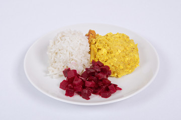 Cauliflower with turmeric and rice on a white