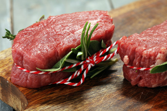 Raw beef fillet steaks with spices for bbq grilling.