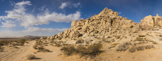 Massive hill consisting of rock boulders and geology.