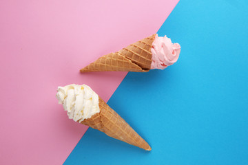 Vanilla frozen yogurt or soft ice cream in waffle cone.