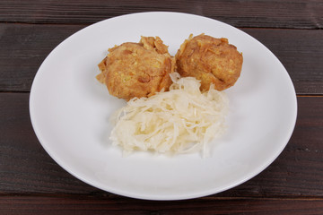 Millets potatoes dumplings with tempeh on a table