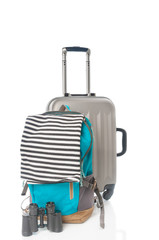 Travel bag, backpack with marine vest and binoculars on white background