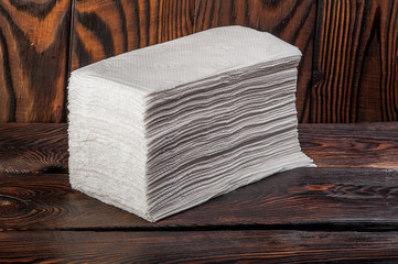 toilet paper on wooden background