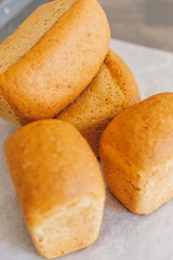 Baked bread close-up folded on the table in the bakery