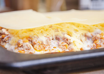 Delicious lasagna with meat covered with cheese