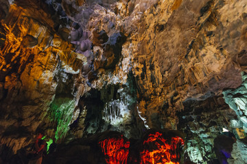 Inside Dong Thien Cung Cave that decorated with artificial green lights at Ha Long Bay. Quang Ninh, Vietnam.