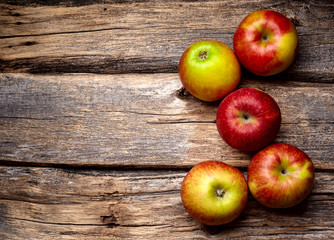 Red apples  on wooden background